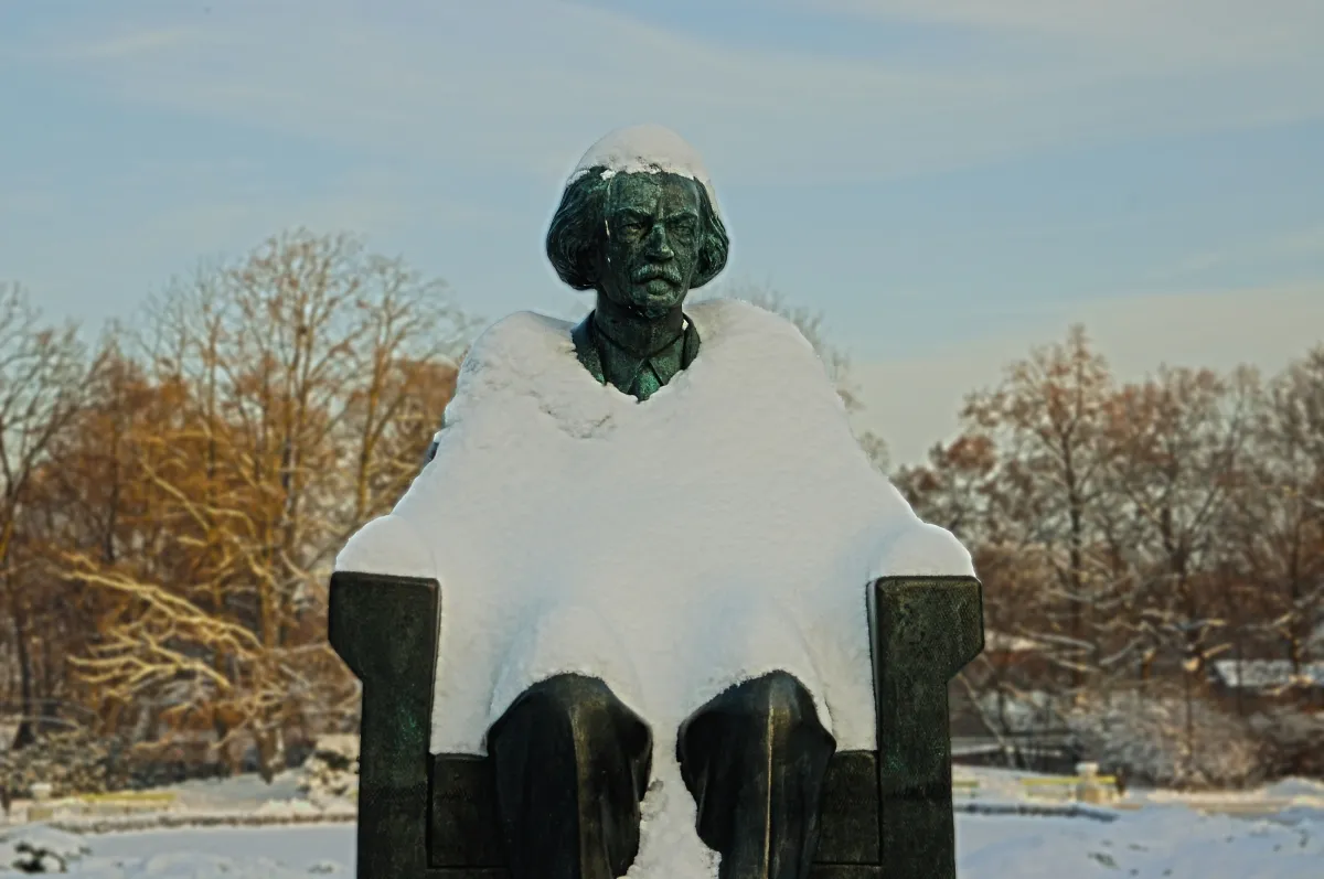 White cloth draped over a bust like a ghostly figure